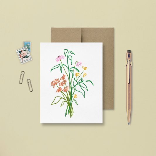 carte de souhait avec une illustration minimaliste et colorée d'un bouquet de fleurs sauvages